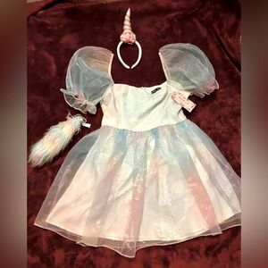 Iridescent rainbow dress, with unicorn costume optional accessories.
